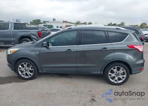 2016 Ford Escape Titanium z USA, uszkodzony, nr VIN 1FMCU0J99GUB82276